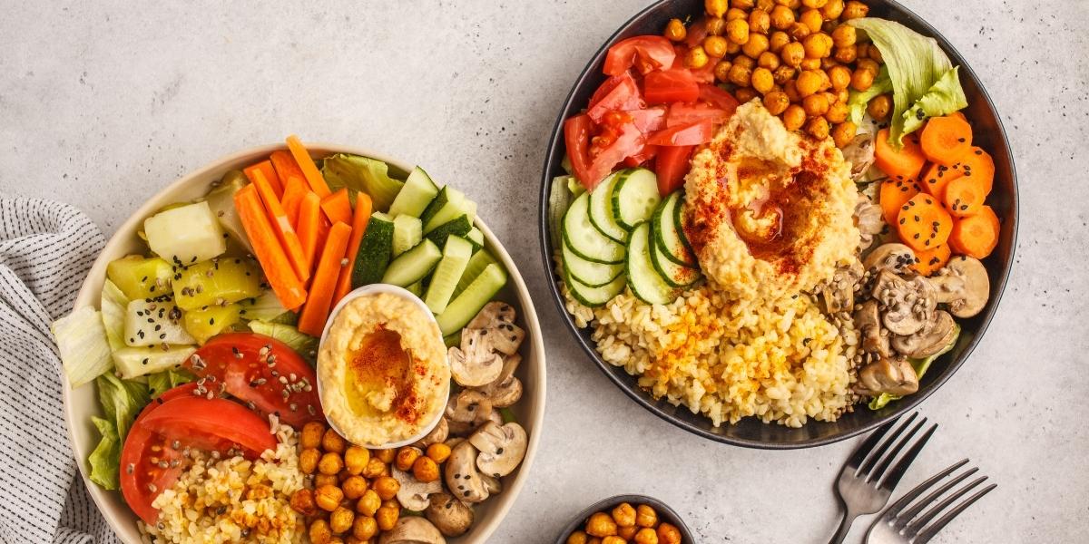 Vegan snack bowls; houmous, raw veggies, chickpeas