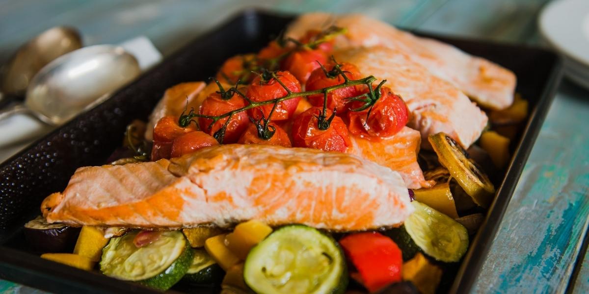 Mediterranean salmon tray bake with roasted veggies.