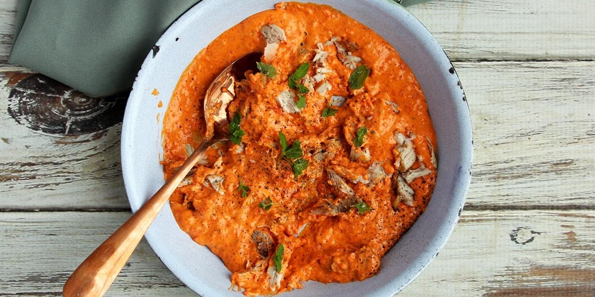 Chicken in red pepper cream.