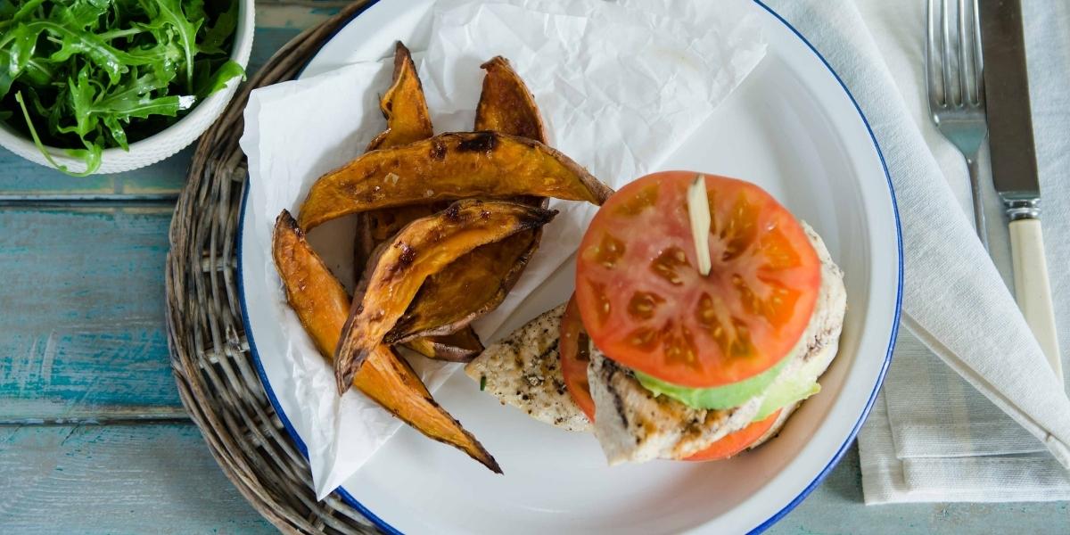 Chicken, tomato & avocado stack with sweet potato wedges