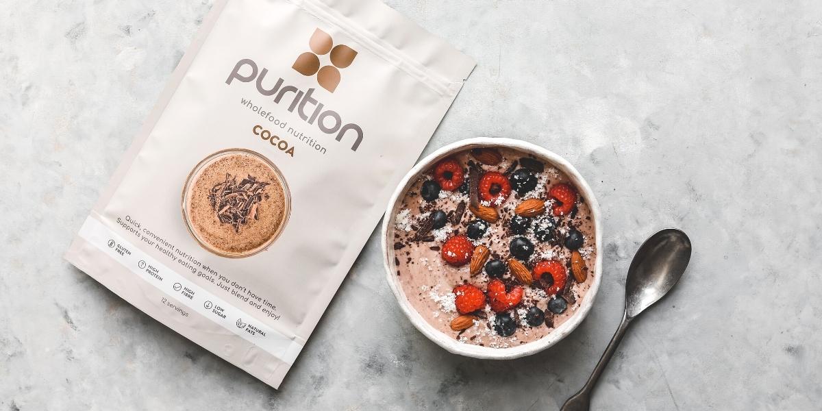 Purition Chocolate breakfast smoothie bowl, high in protein.