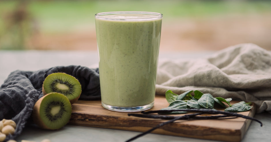 Green breakfast smoothie, kiwi, spinach and pistachio.