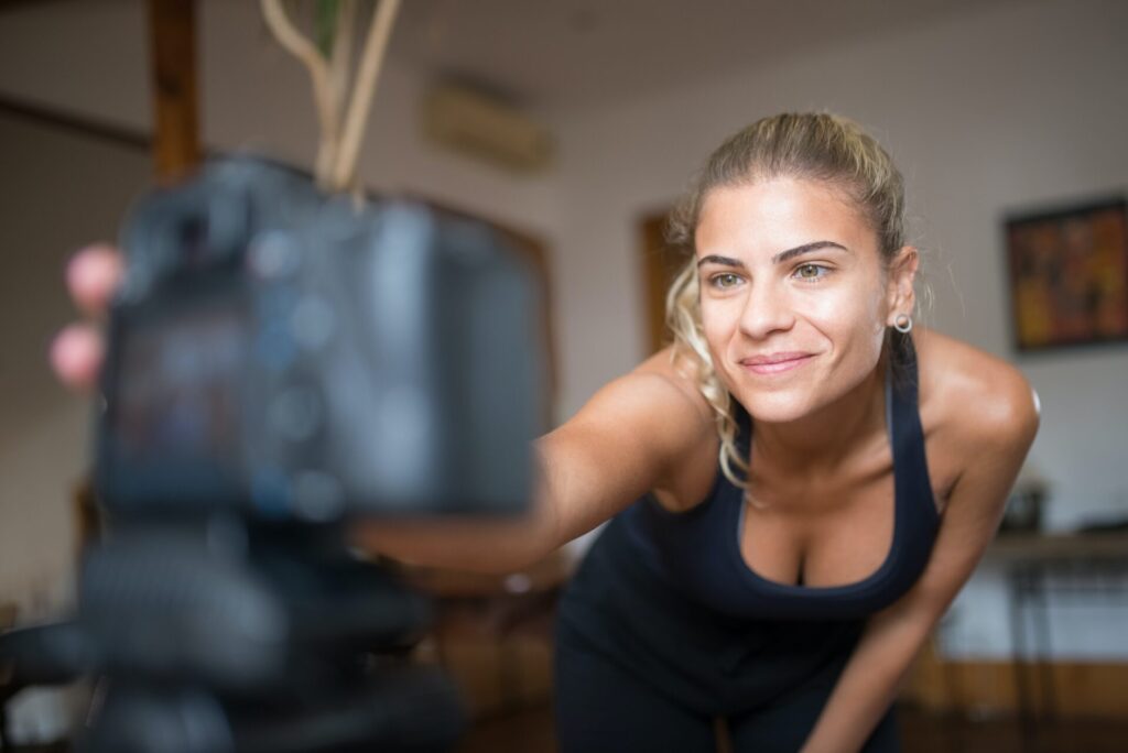 Woman Uses Webcam for Teaching Fitness