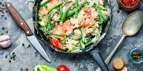 Scrambled eggs with vegetables in pan